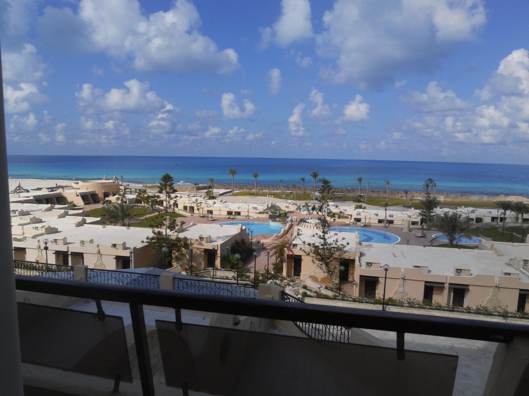 Borg El Arab Beach Resort Exterior foto View of the beach from the hotel