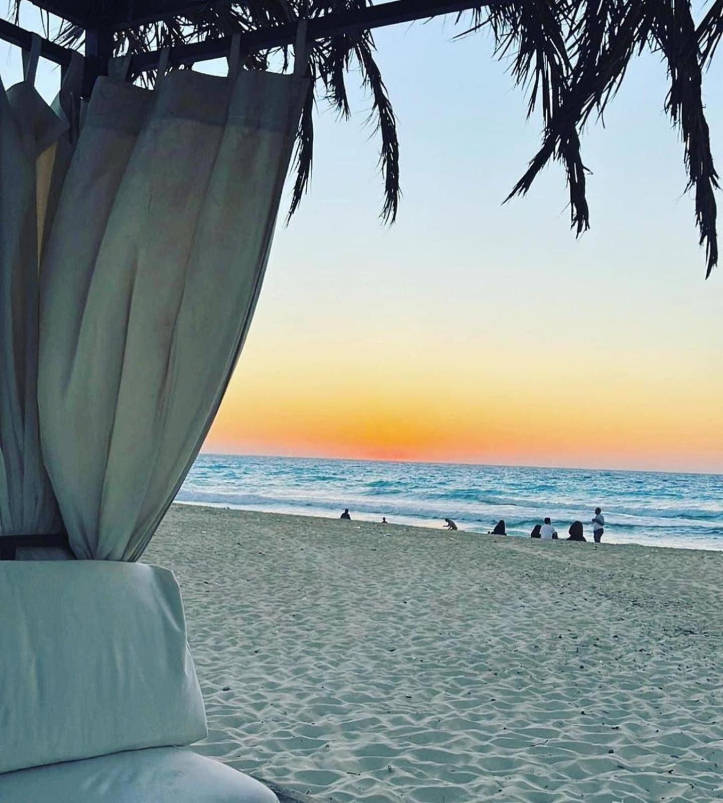 Borg El Arab Beach Resort Exterior foto Sunset at the beach